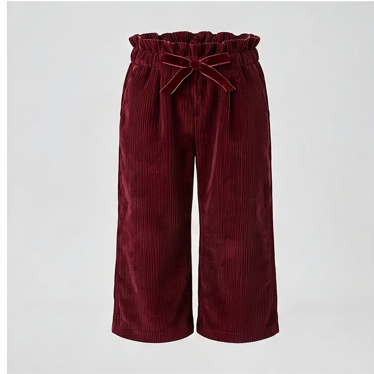 Robin Needlecord Trousers in burgundy needlecord, front view with velvet bow at the waist