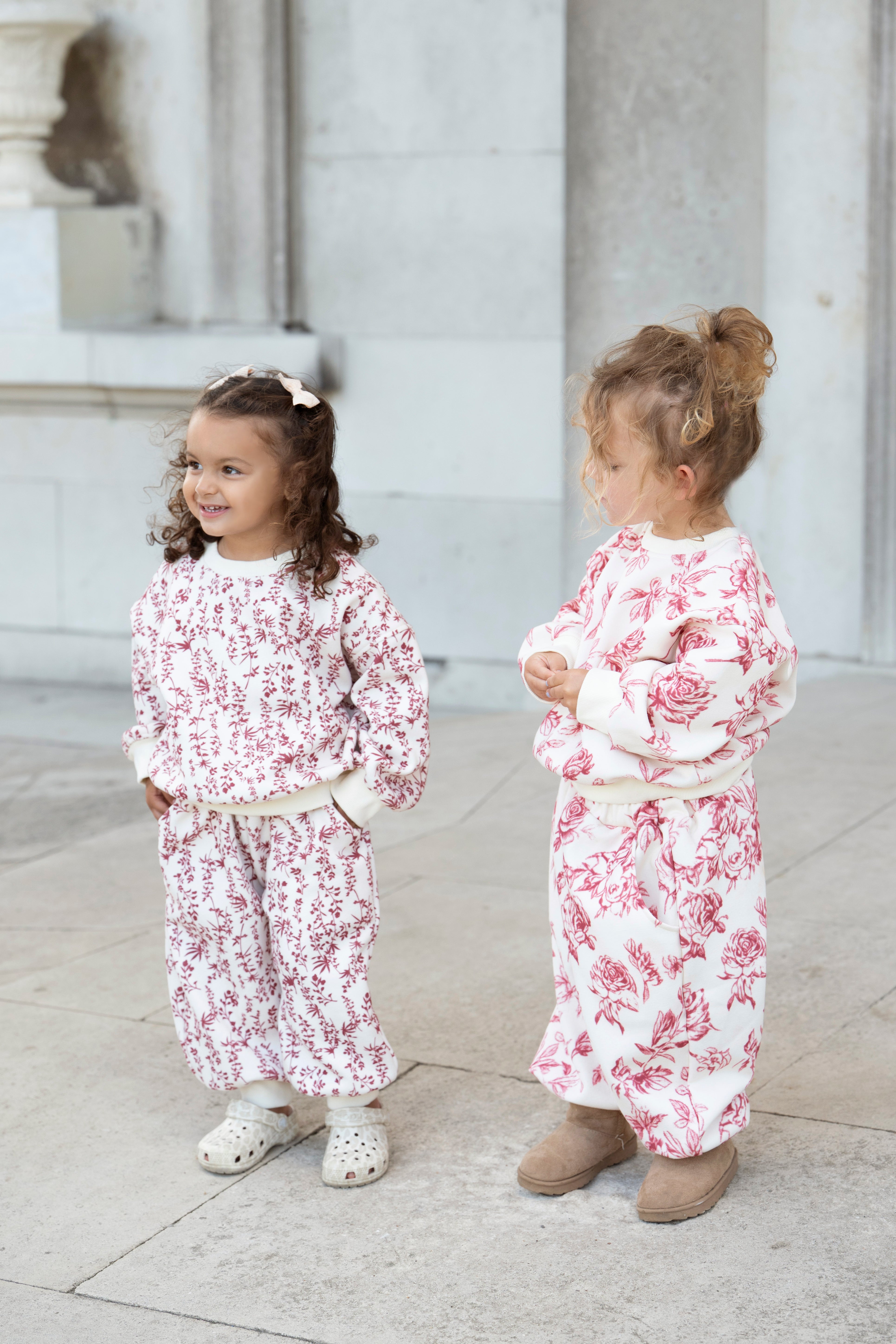 Rose Tracksuit — two children wearing matching Rose print tracksuits
