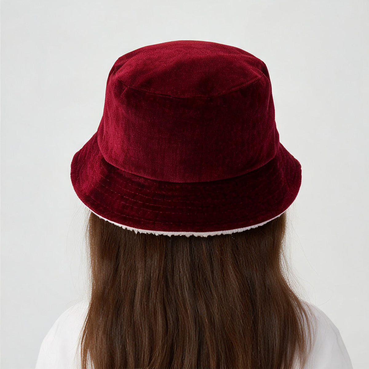 Back view of the Robin Bucket Hat in burgundy velvet with cream sherpa trim
