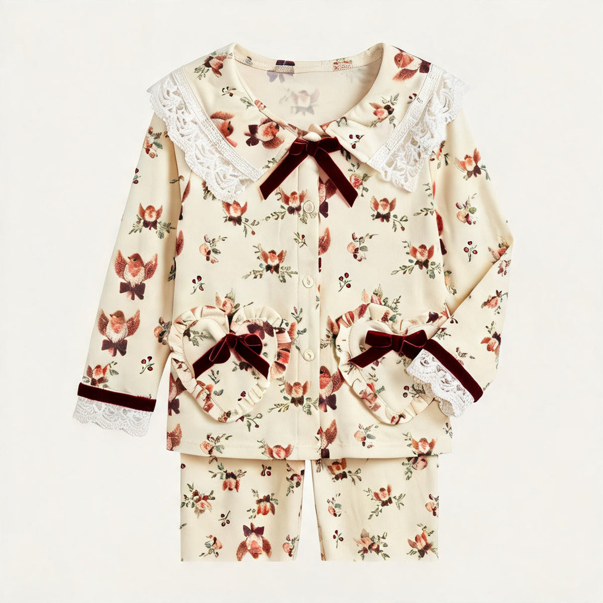 Christmas Pyjamas for girls in cream cotton with a robin and rosebud print, lace collar and burgundy velvet bows, White Daisy